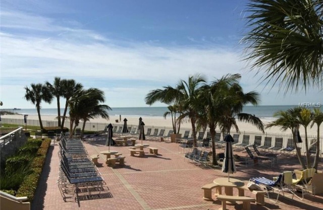 Enjoy Beachfront Living, relax in the heated pool, in gated community