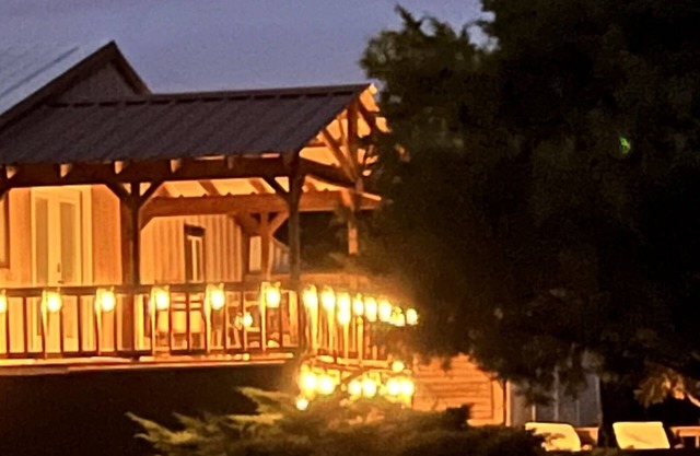 Enjoy our loft with a private hot tub overlooking the vineyard and pond.
