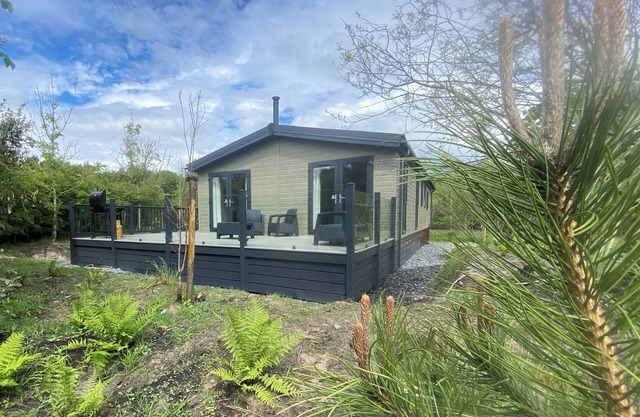 Experience the ultimate retreat in this stunning woodland lodge.