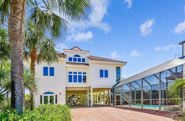 EXPERIENCE THE ULTIMATE IN ISLAND LIVING at the incredible beach front home AMBASSADOR.
