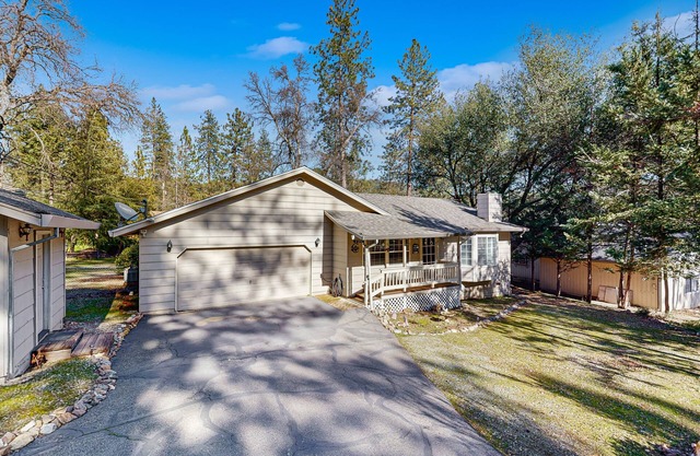 Family-friendly home with deck, stainless steel appliances, & spacious yard