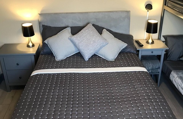 Family room with 3 beds (sleeps 4) on grond floor.