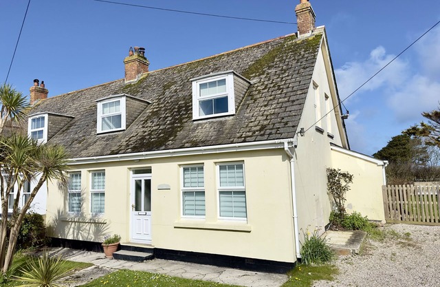 Four bedrooms with garden and driveway parking. Pets welcome.