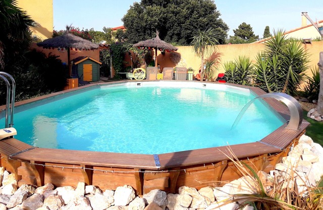 Gite saint julien in rez of garden with terrace swimming pool and games.