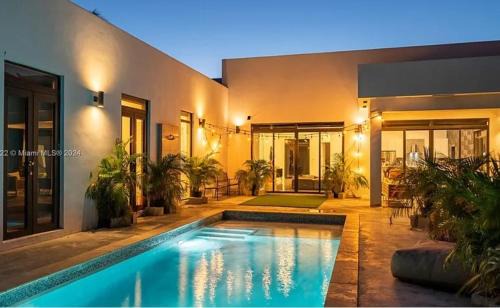 Glamorous Waterfront Canal Home with Private Dock and Pool
