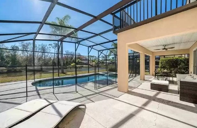 Gorgeous water view from South facing pool deck. Balcony off upstairs master bed