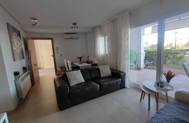 Ground Floor Apartment with Terrace and Garden facing a huge Swimming Pool
