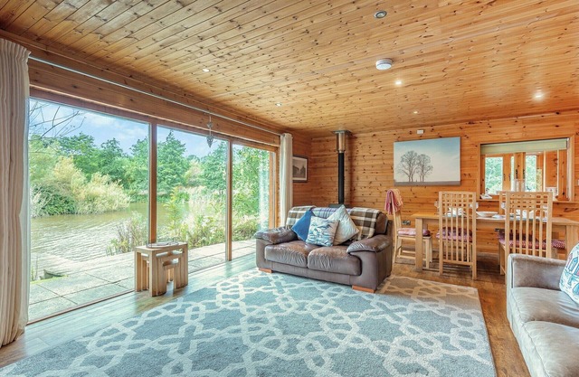 Ground floor: Spacious open plan lounge, kitchen, dining area with log burner.