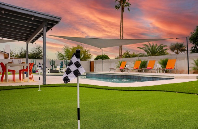 Heated Pool + Putting Green + 2 Car Garage