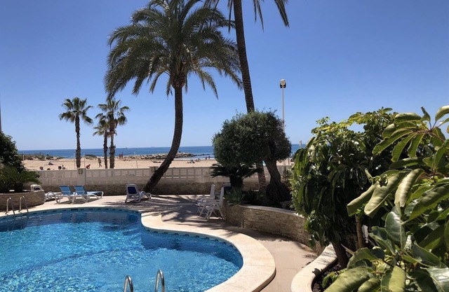 Holiday Apartment 'Front Line on the Beach' with Sea View, Pool, Garden & Wi-Fi