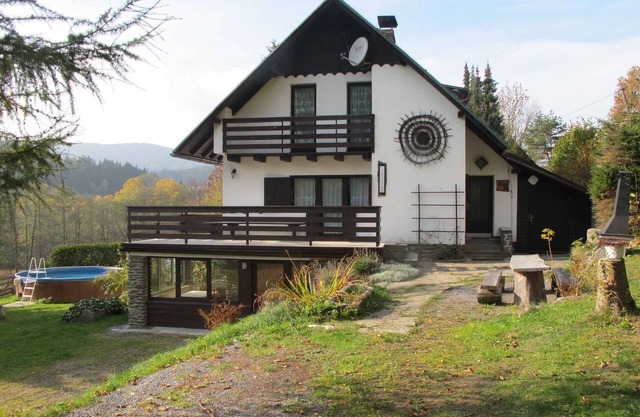 Holiday home with fireplace, sauna, games room and heated pool