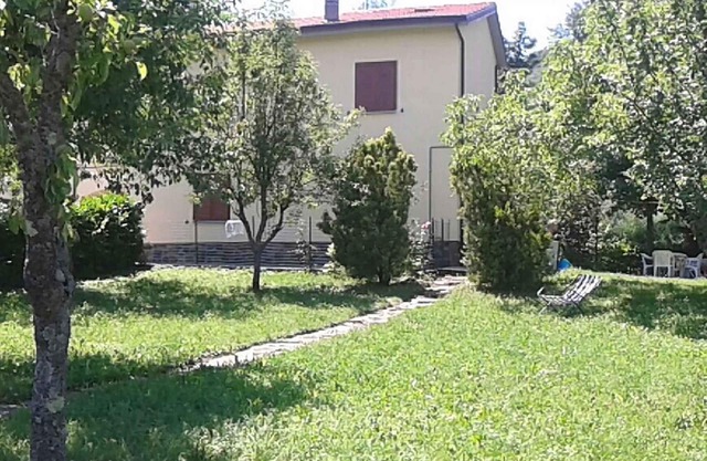 Holiday home with panoramic garden near the lake Suviana