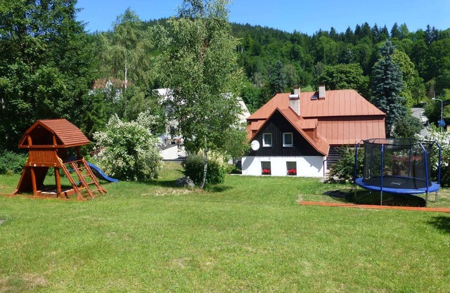 Holiday home with wood-burning fireplace situated on a slope