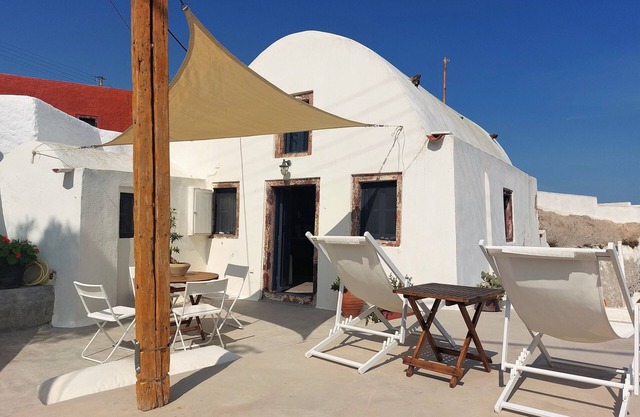 House of the Seven Ships. Cycladic traditional house with sea and sunset view