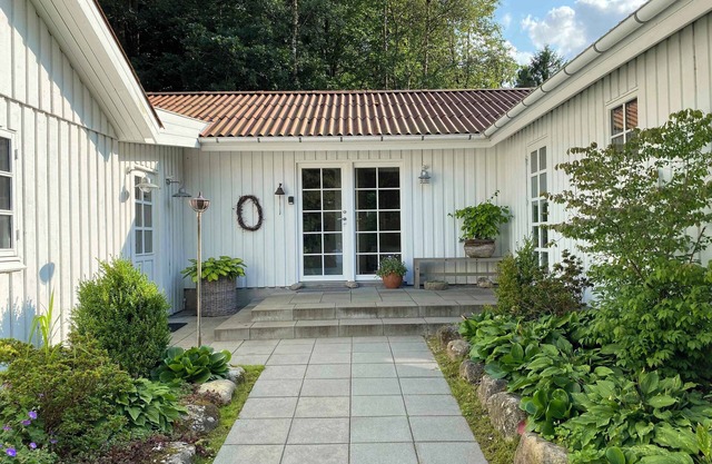 Idyllically situated wooden house by the forest