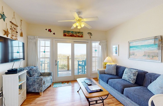 Inviting beachfront condo featuring hot tub & pool, central AC, elevator, & deck