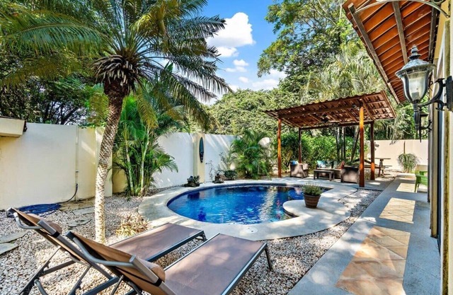 Inviting Home with Colorful Decor and Private Backyard Oasis with a Swimming Poo