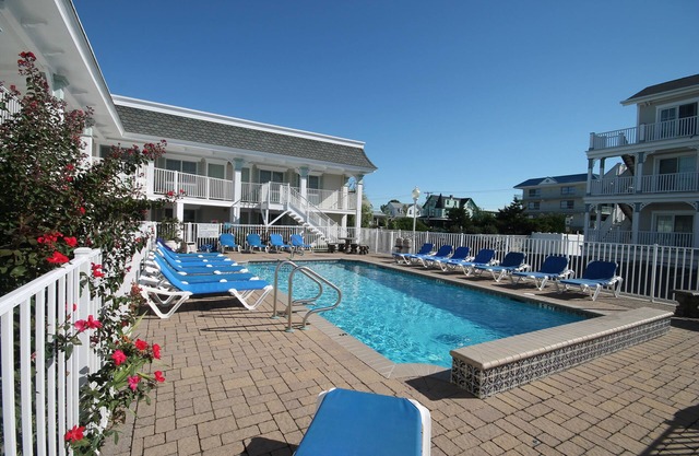 JUST ACROSS THE STREET FROM THE BEACH! PARK YOUR CAR & WALK! Granite countertops and stainless appliances. In ground pool at property.