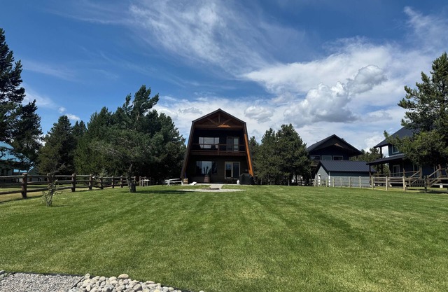 Lakefront 4BR/4BA Cabin with Sauna, Hot Tub & Private Dock – Minutes from YNP!