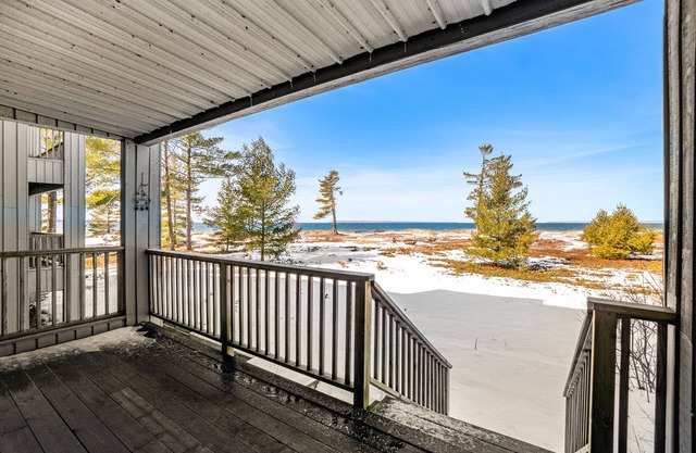 Lakefront condo with deck, gorgeous view, fireplace, & W/D