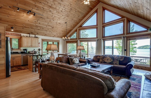 Lakefront lodge with private dock, firepit, deck & sunset views