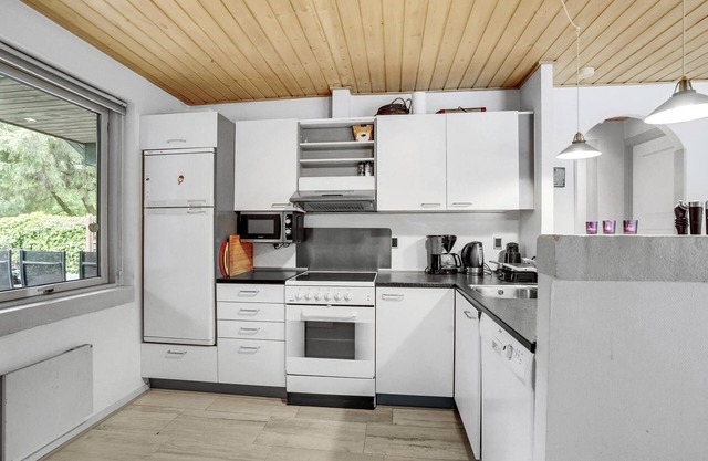 Large and spacious pool house with spa and access to sauna.