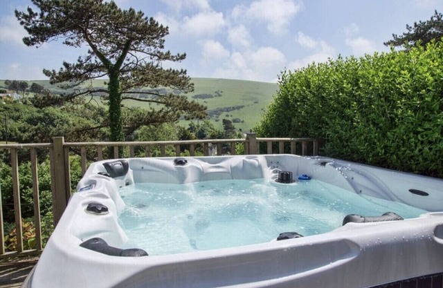 Large House walk to Woolacombe Beach. Large outside. Hot tub. Dog Friendly.