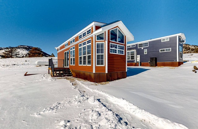 Light-filled cabin on 1,800-acre working ranch with animals, mountains & games