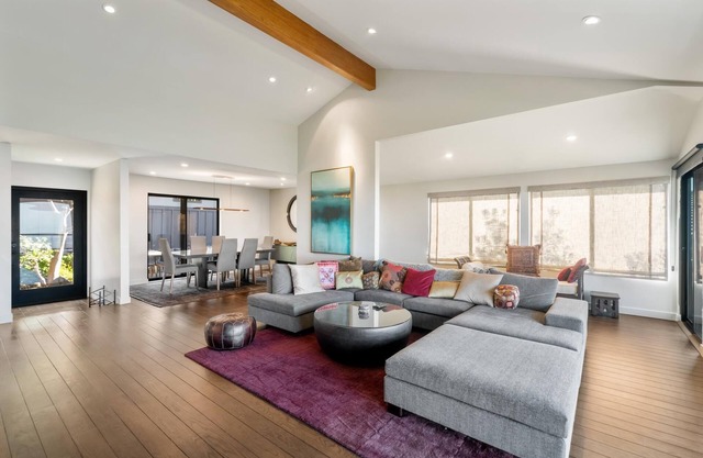 Live in luxury in this meticulously updated 3BR/3BA Claremont Heights mid-century modern home w/AC.