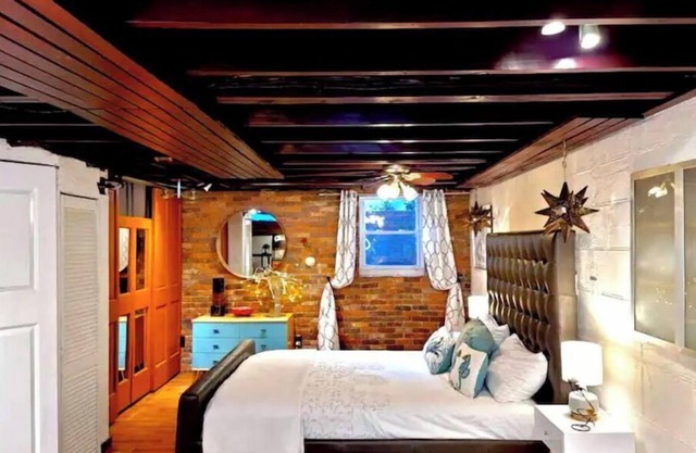 Live in this iconic East Side lower level apartment