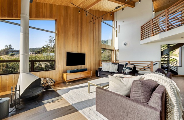 Luxe retreat with ocean views, hot tub, & gourmet kitchen - steps from beach