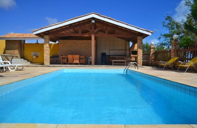 Luxurious beach house with pool, seafront terrace.