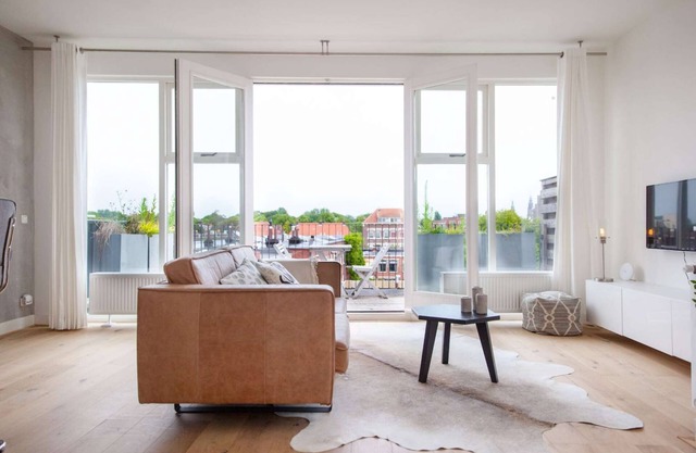 Luxurious rooftop penthouse with rooftop terrace, a balcony, bath, duo shower