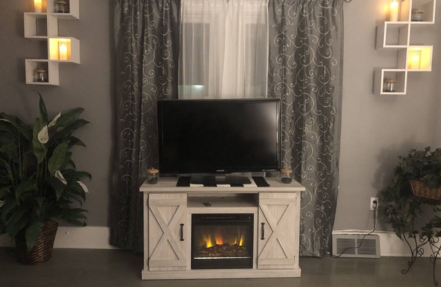 Luxury Cali King Suite · Smart TVs & Wireless Charging in Every Room