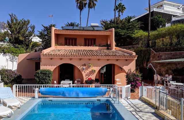 Luxury villa with private heated pool in private garden. Close to beaches.