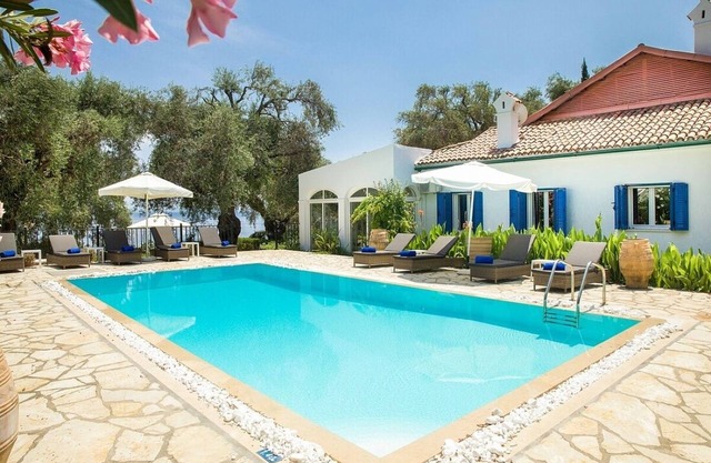 Majestic Beach Front Villa, 10 mins walk to Barbati Village, A/C, Private Pool, Sea Front Patios!