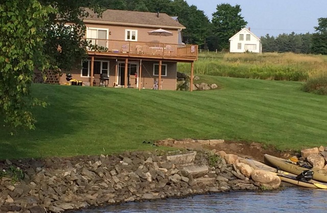Memphremagog lakefront home, large yard, waterfront, dock, and small beach