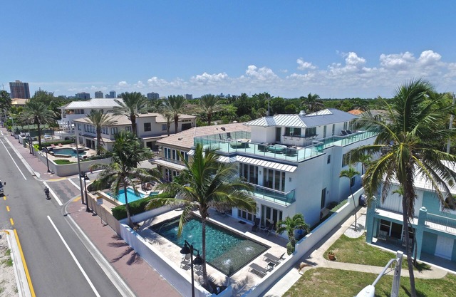 Modern 7,000 SF Beachfront Estate w/Roof Deck