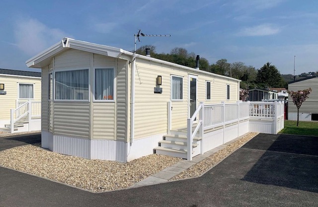 Modern and contemporary 12ft-wide caravan with one double and two twin.