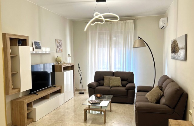 Modern apartment in the center with private parking space and communal garden