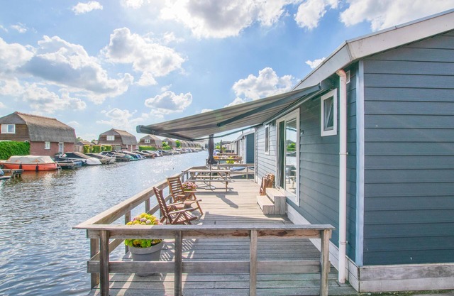 Modern chalet with private jetty on the water