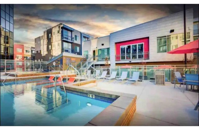 Modern luxury apartment with hot tub and gym!