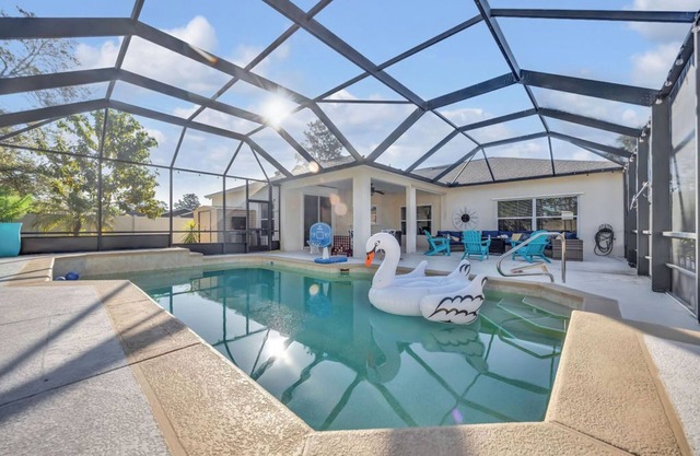 Modern Poolside Getaway w Games, Fire pit & Family Fun