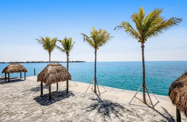 Modern waterfront condo with pool, shared dock, & W/D - snowbird-friendly
