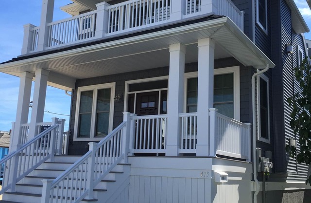 New construction in 2016. Top floor unit, 3 decks, walk to beach