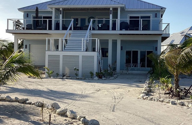 New home w/gorgeous ocean views.,Boat slip , stunning deck & beach access.