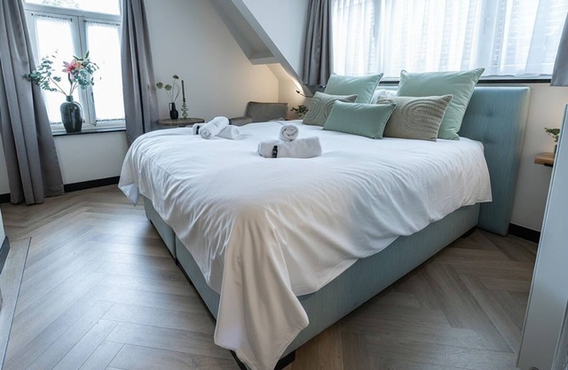 Newly renovated 1920 building with large hotel bed, patio and shared kitchen.