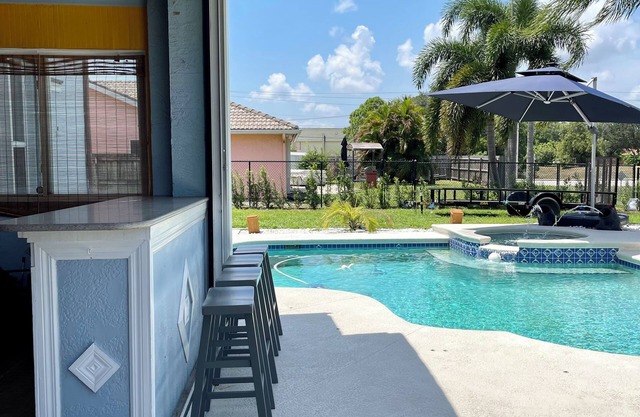 Ocean access with boat dock 4 bedroom 3 bathroom beautiful Pool home with Spa.