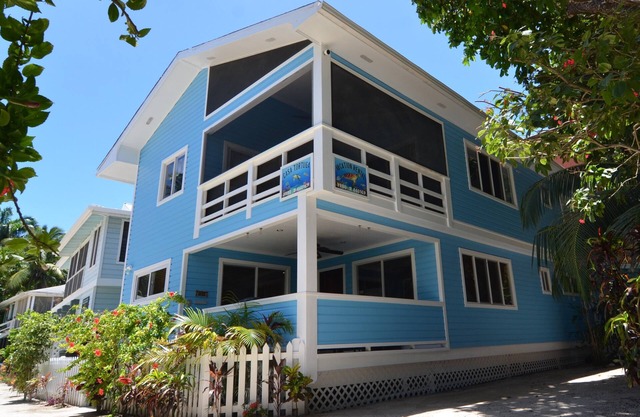 Oceanfront beach house with dual-masters & screened balcony on West Bay Beach