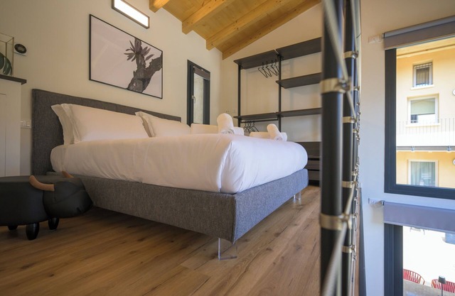 Open space on two floors in detached cottage in ancient medieval courtyard